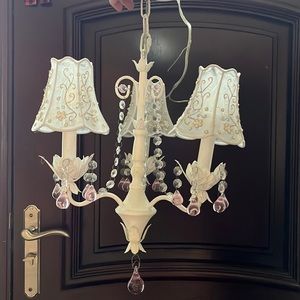 LED bulb 3 light chandelier. White and pink crystals. White design top hats.